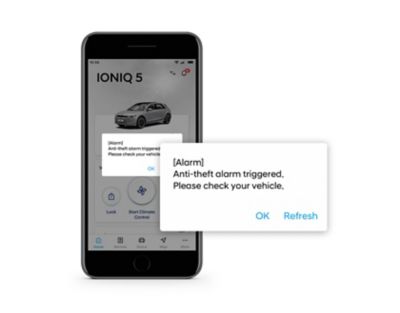Close-up of the Hyundai Bluelink app with a theft detection push notification.