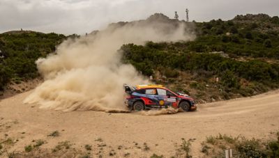 Hyundai Motorsport driver Dani Sordo's i20 N WRC Rally1 drifting around a corner.