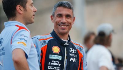Hyundai Motorsport co-driver Cándido Carrera smiling in his race-suit.
