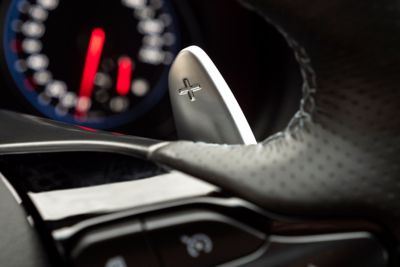 Detail of the racing-inspired paddle shifters on the steering wheel of the Hyundai i30 N