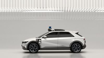 IONIQ 5 Robotaxi: next-generation driverless vehicle shown from the side.