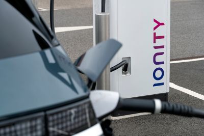 A man charging his Hyundai IONIQ.