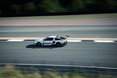 Hyundai N Vision 74 concept car in the curve of a racetrack.