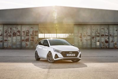 The all-new Hyundai i20 N Line in front of a building with large windows