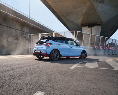 The all-new Hyundai i30 N pictured from the side in a sporty driving situation.