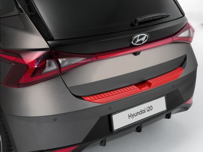 Rear bumper trim line on a Hyundai i20 in tomato red.