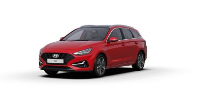 De nieuwe Hyundai i30 Wagon gezien van linksvoor, in de kleur Engine Red.