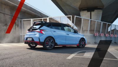 The Hyundai i20 N seen from behind taking a sharp turn.