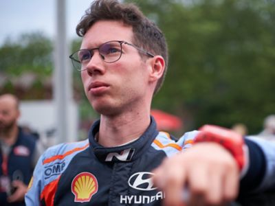 Hyundai Motorsport co-driver Martijn Wydaeghe looking at something in the distance.