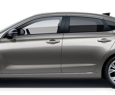 The Hyundai i30 Fastback pictured from the driver side, focused on the doors roof, windows, and doors