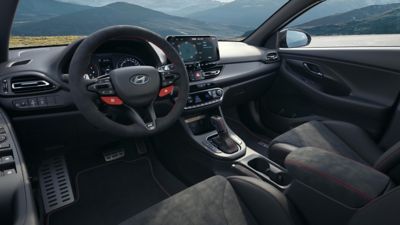 Sporty cockpit of Hyundai i30 Fastback N Drive-N Limited Edition with red stitching and Alcantara.