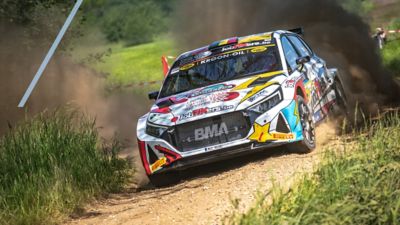 Hyundai i20 N Rally2 during a race on a gravel road.