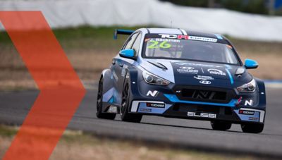 The Hyundai i30 N TCR on a racetrack.