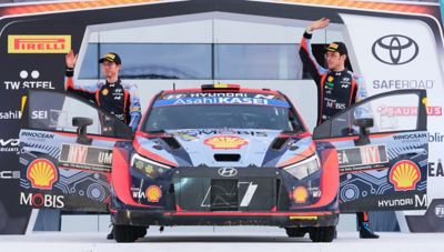 Hyundai Motorsport driver Thierry Neuville and his co-driver Martijn Wydaeghe waving.