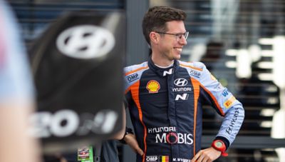 Hyundai Motorsport co-driver Martijn Wydaeghe smiling in his race-suit.