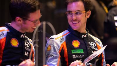 Hyundai Motorsport driver Thierry Neuville and his co-driver Martijn Wydaeghe smiling.