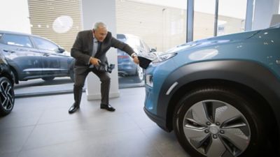 A Hyundai dealer giving a live video tour of a KONA Electric using a GoPro action camera.