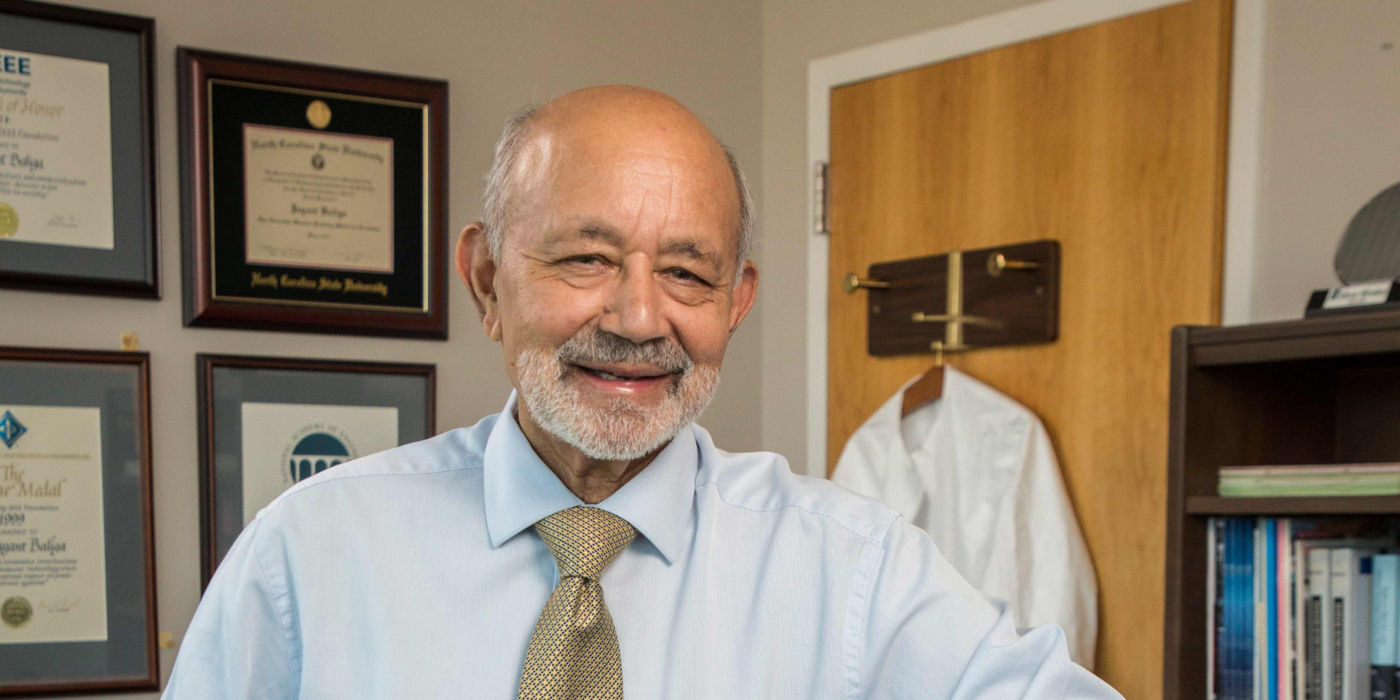 Professor Bantval Jayant Baliga with books he has written about the IGBT device.