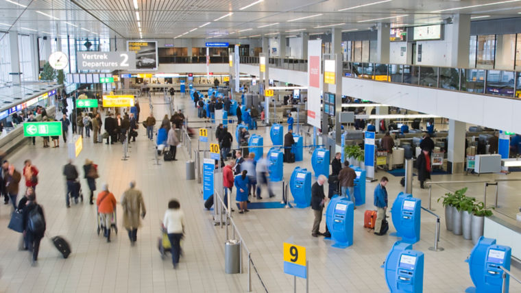 People flow at the departure lobby in the Schiphol airport.