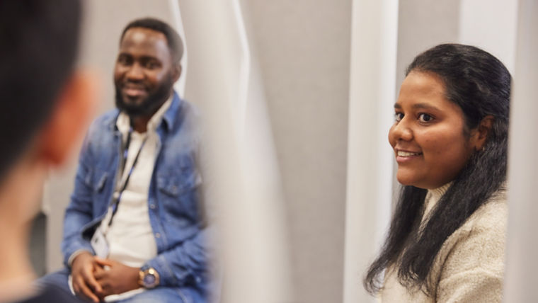 KONE employees having an office meeting.