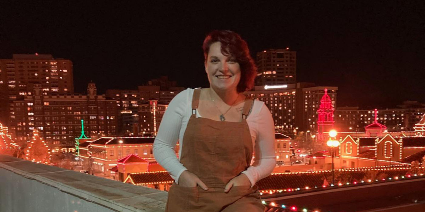 KONE Service Mechanic Jessica Lawler with city lights in the background.