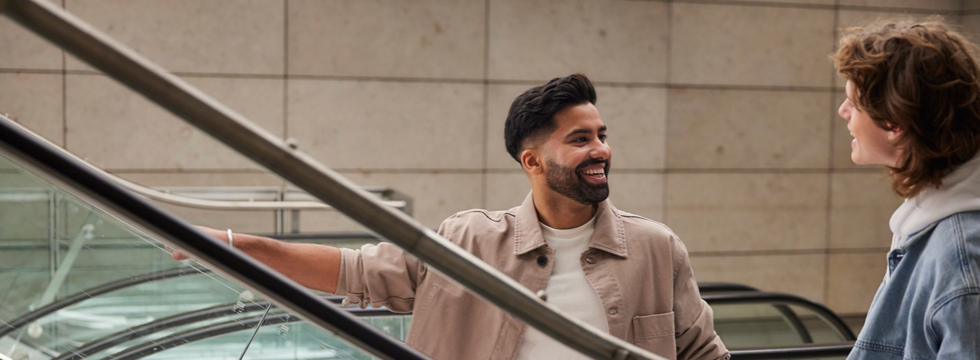 -Smiling men on escalator