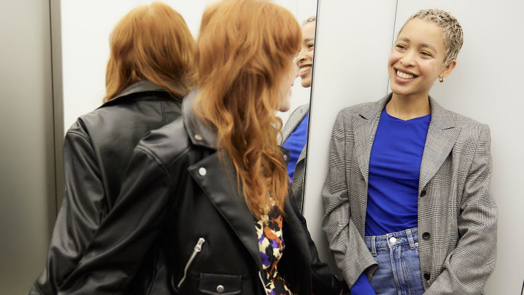 Happy women inside elevator