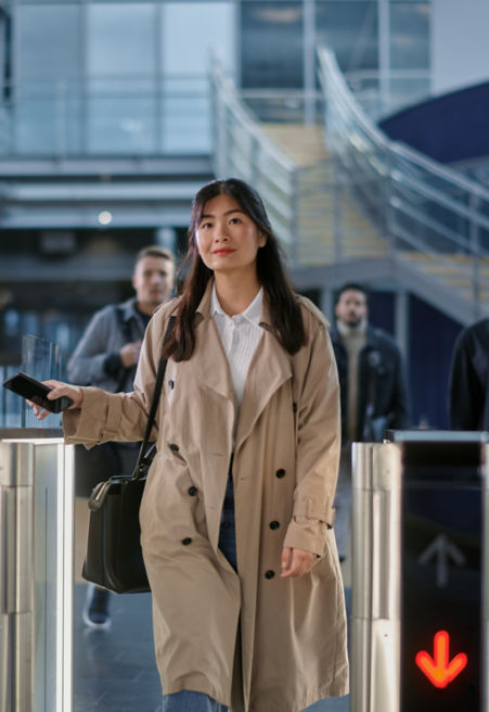 young woman using a turnstile