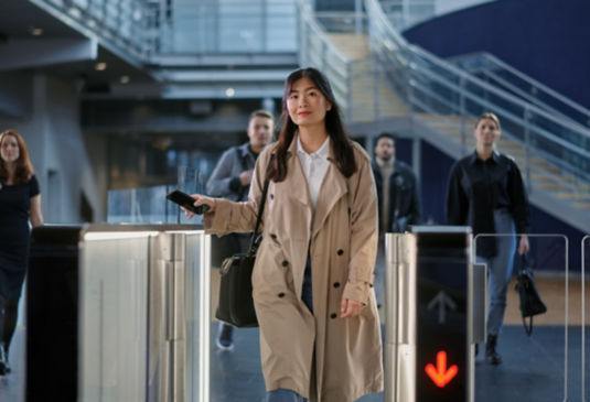 young woman using a turnstile