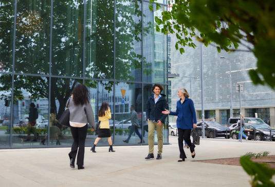 Two people walking in the city.