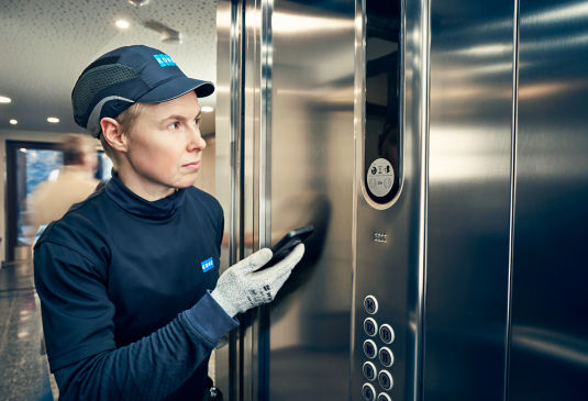 KONE technician in a lift