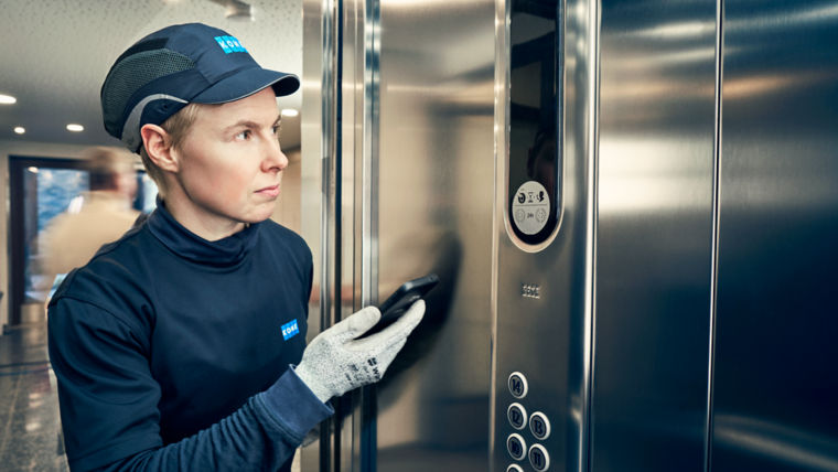 KONE technician in a lift