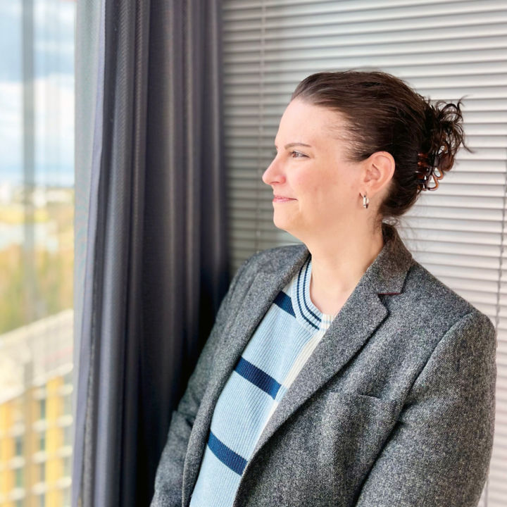 Kelly Hines looking out of window.