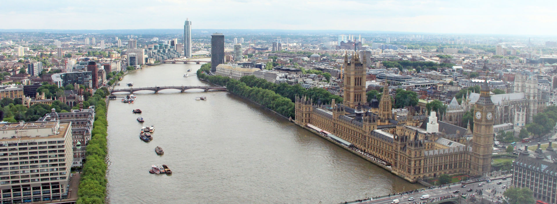 View of London and the River Thames with the Palace of Westminster in the foreground.