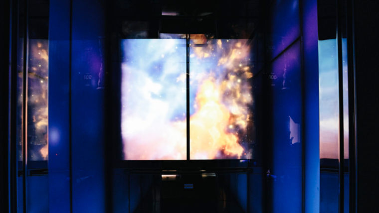 KONE Digital Experience Car with blue color theme on digital displays and light panels.