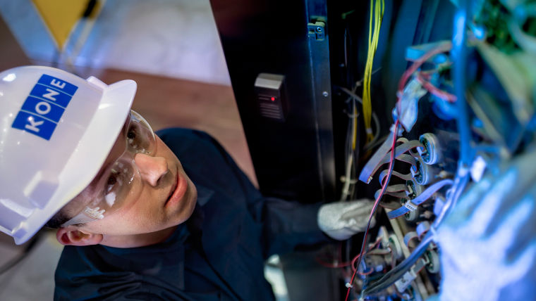 Maintenance technician working on cables of an elevator - KONE