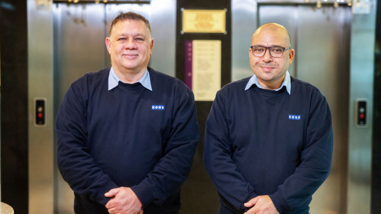 Two KONE Employees standing in front of elevator