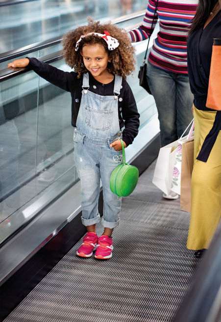 Little girl on an autowalk.