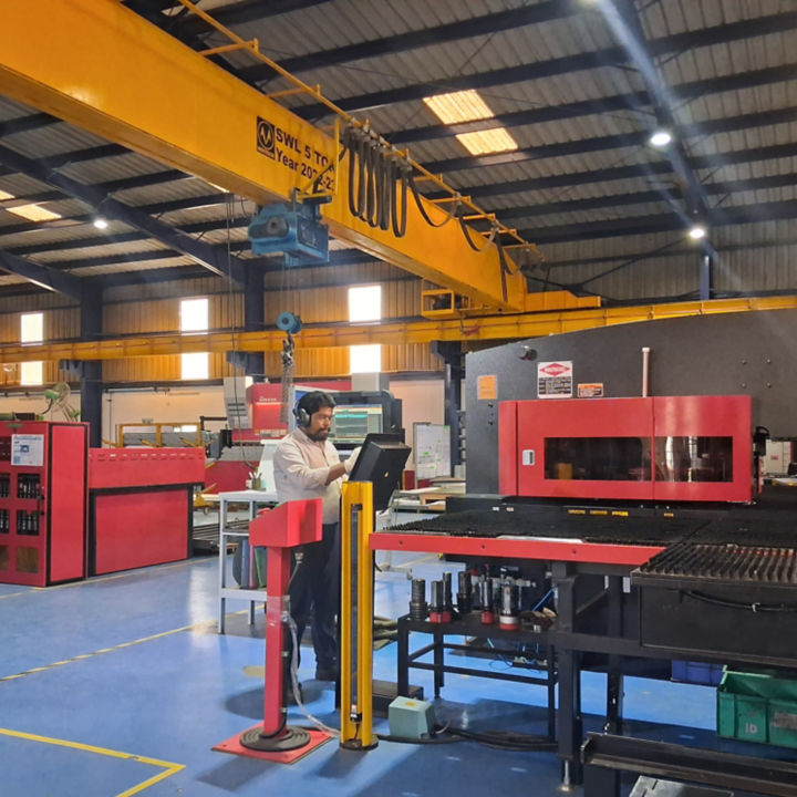 Worker at Viman Multiplug factory in India.