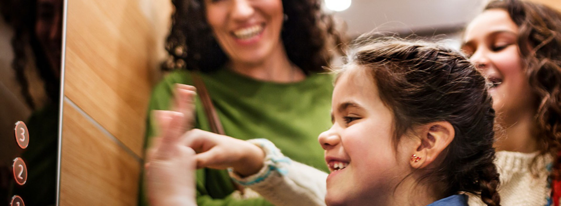 Women-With-Two-Girls-In-Elevator