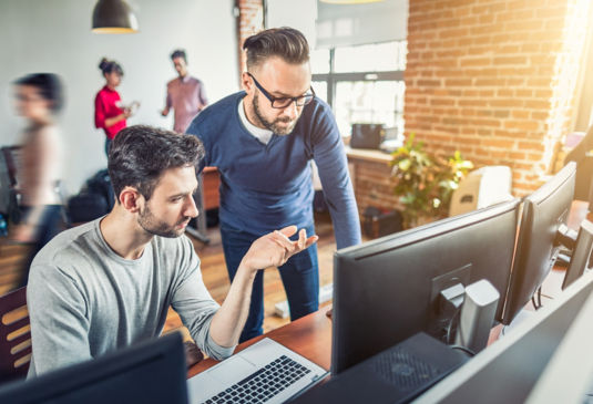 colleagues_collaborating_at_work:535x365