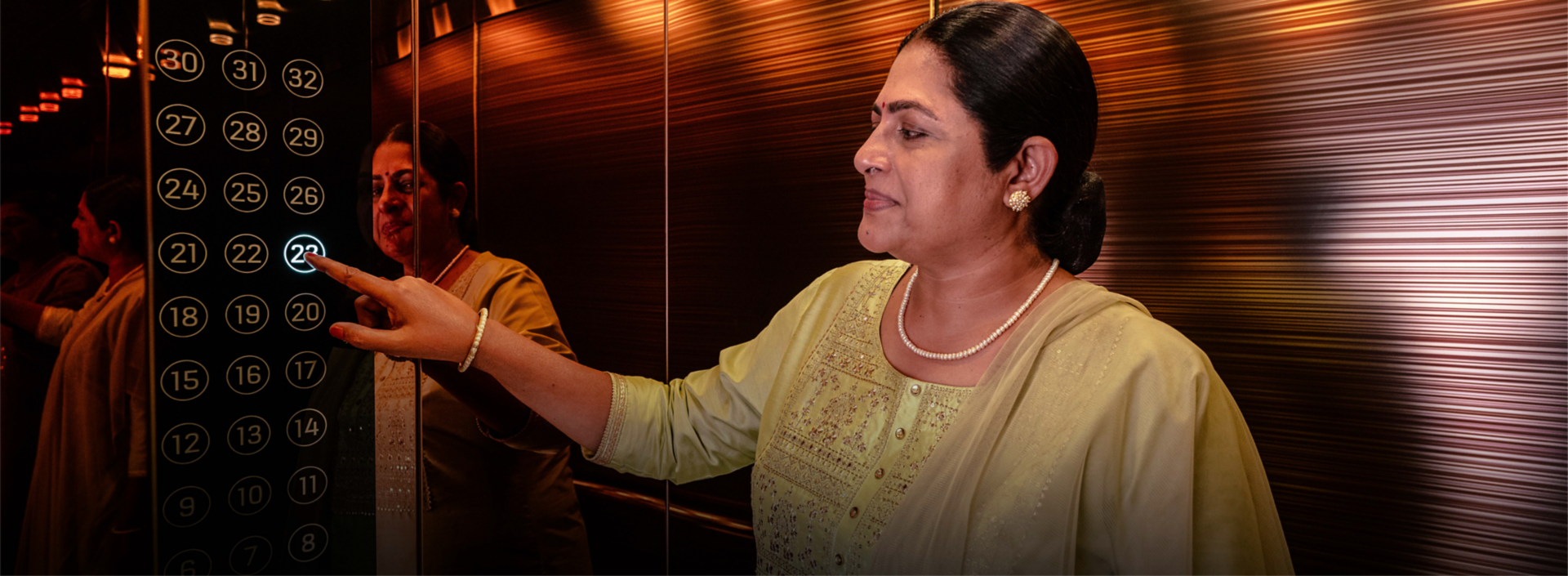 Indian_Women_experiencing_KONE_DX_Class_elevators