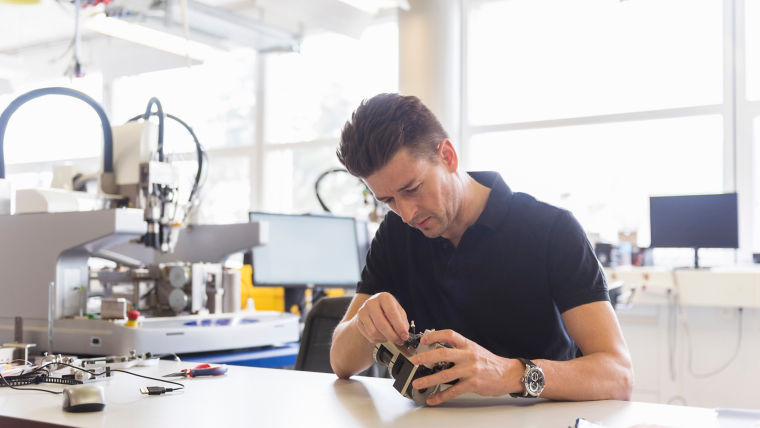 man_working_on_product_in_factory_:760x428%2816-9%29