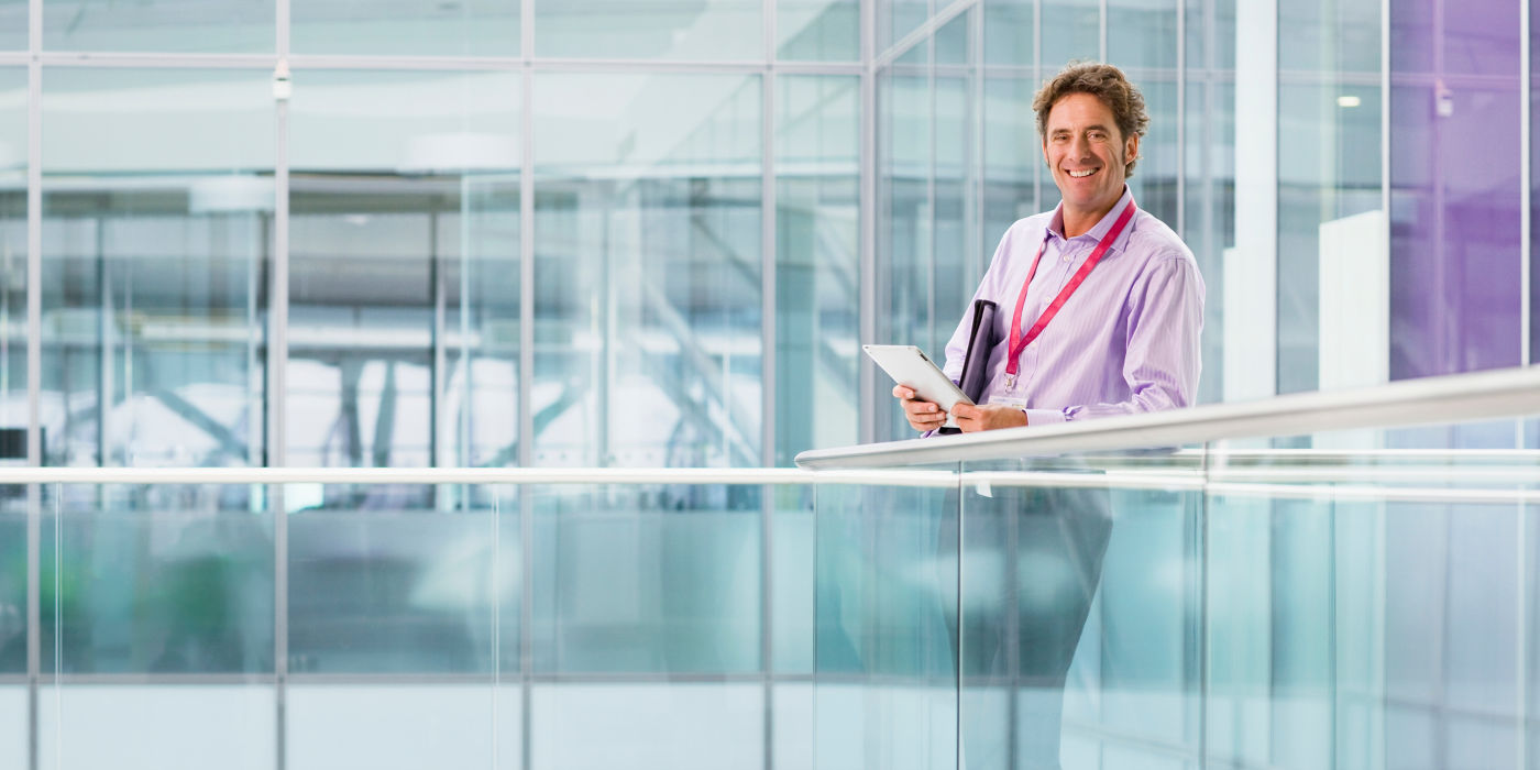 mature-businessman-in-modern-office-using-digital-2026-01-11-08-02-33-utc:1400x700