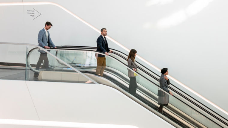 people_in_modern_escalator-1:760x428%2816-9%29