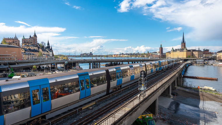 View of the center of Stockholm with metro train in the foreground.