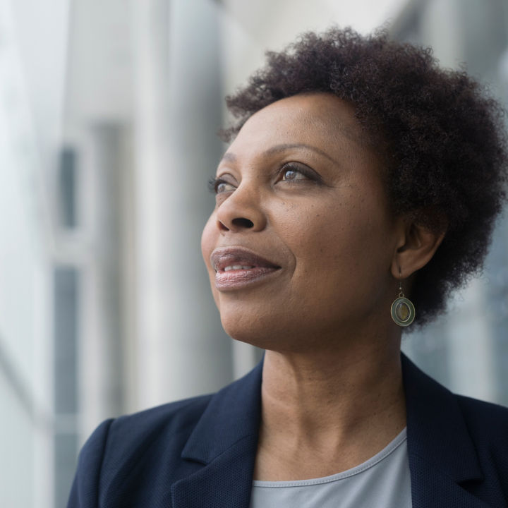 Portrait pensive businesswoman looking away