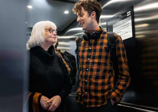 young_man_and_older_lady_in_residential_builings_elevator:669x475