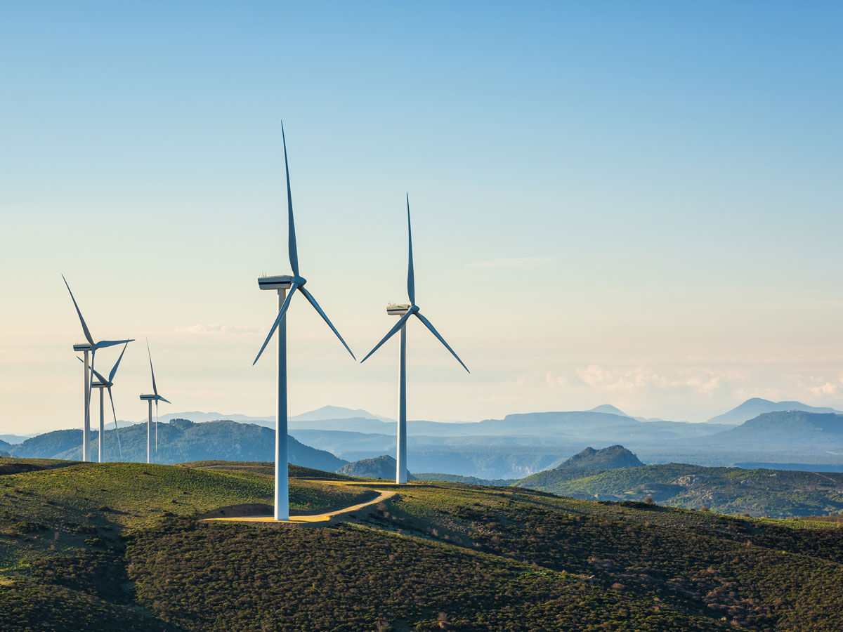 Turbines in a mountain wind farm. Ecological energy production.