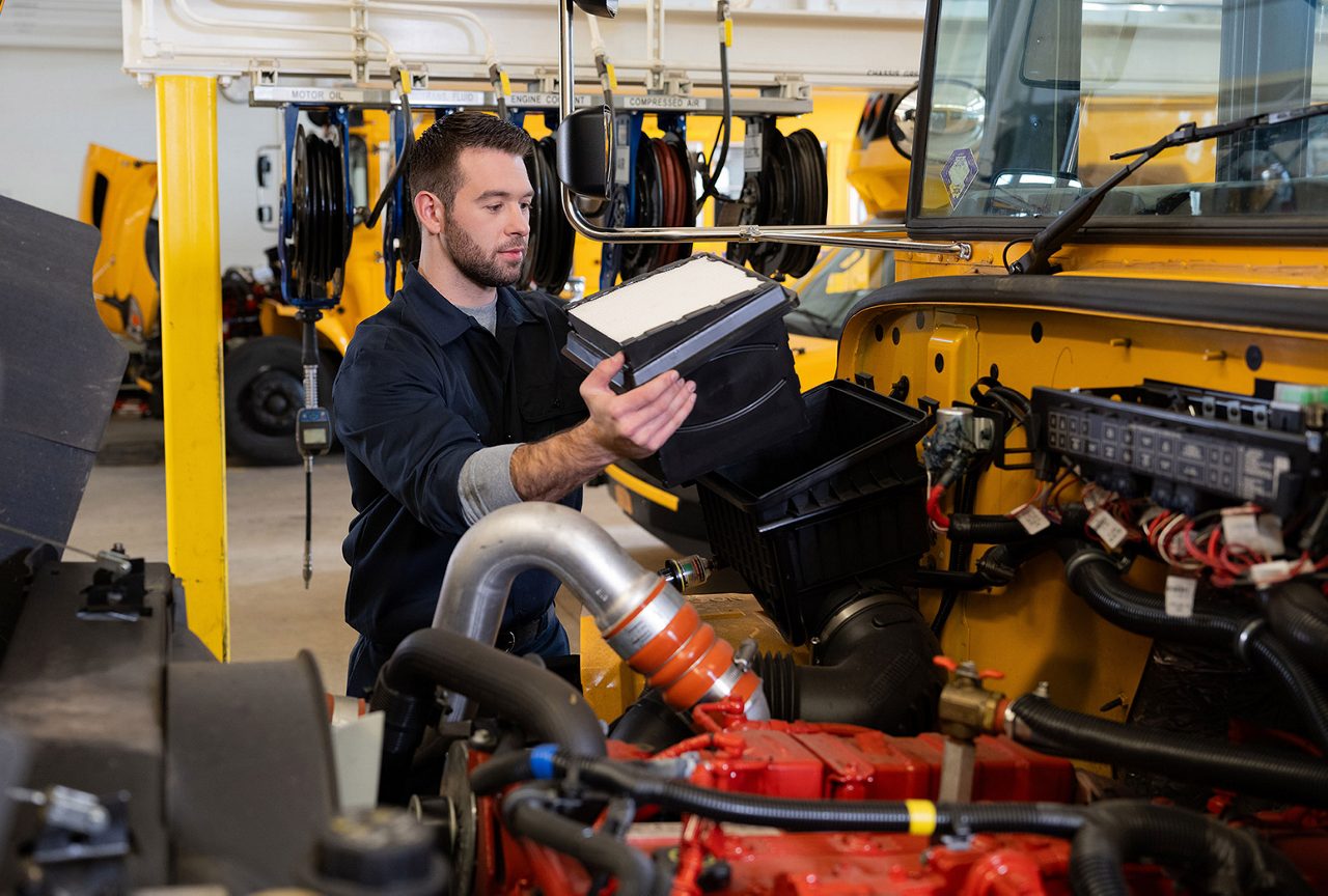 Mechanic changing a filter